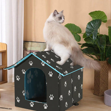 Black house-shaped outdoor waterproof cat bed made of 600D Oxford cloth with high-density foam insulation and a 4-season memory foam cushion.