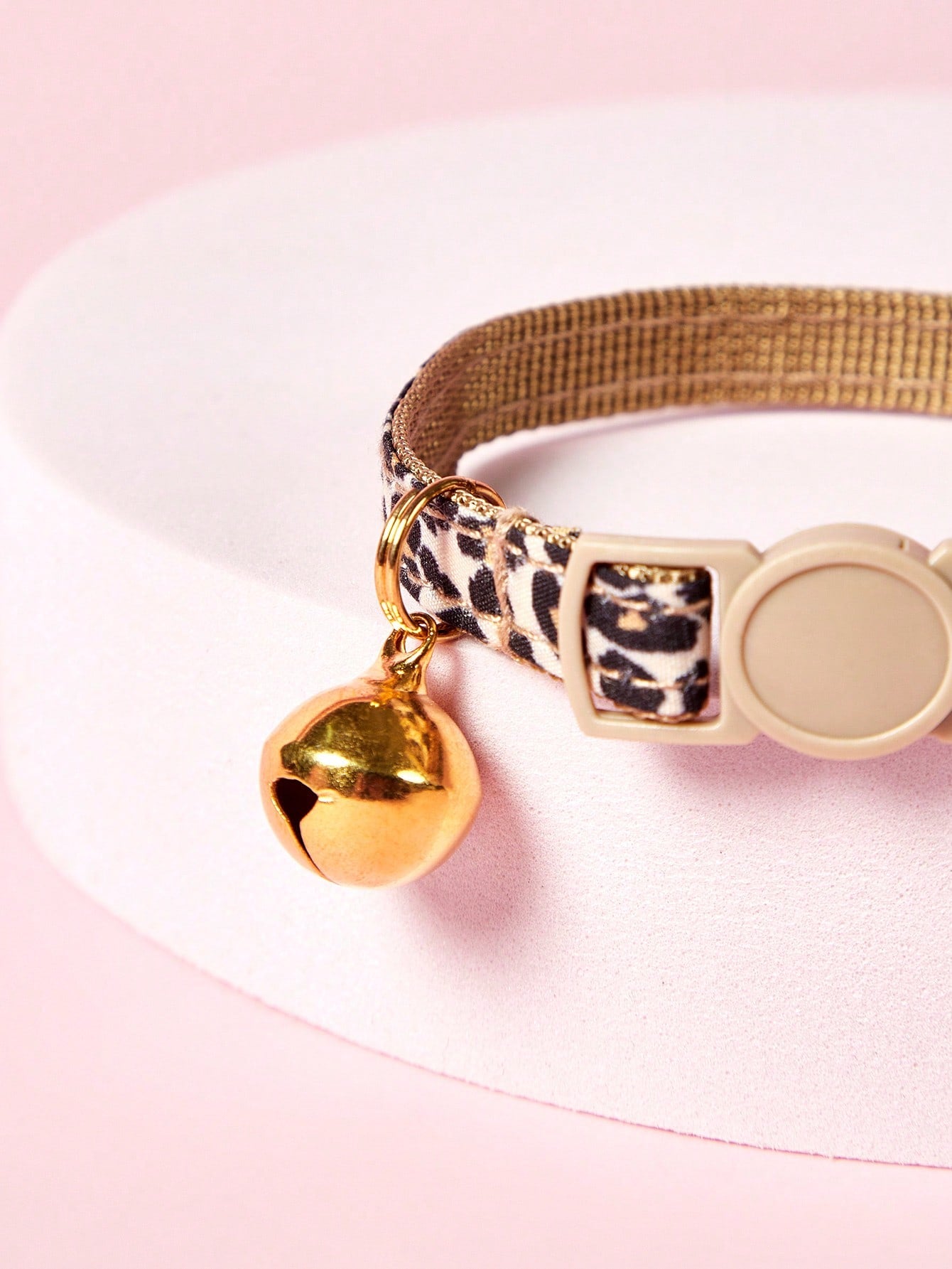 Leopard print adjustable cat collar with golden bell for cats and small pets, made from multicolor polyester.