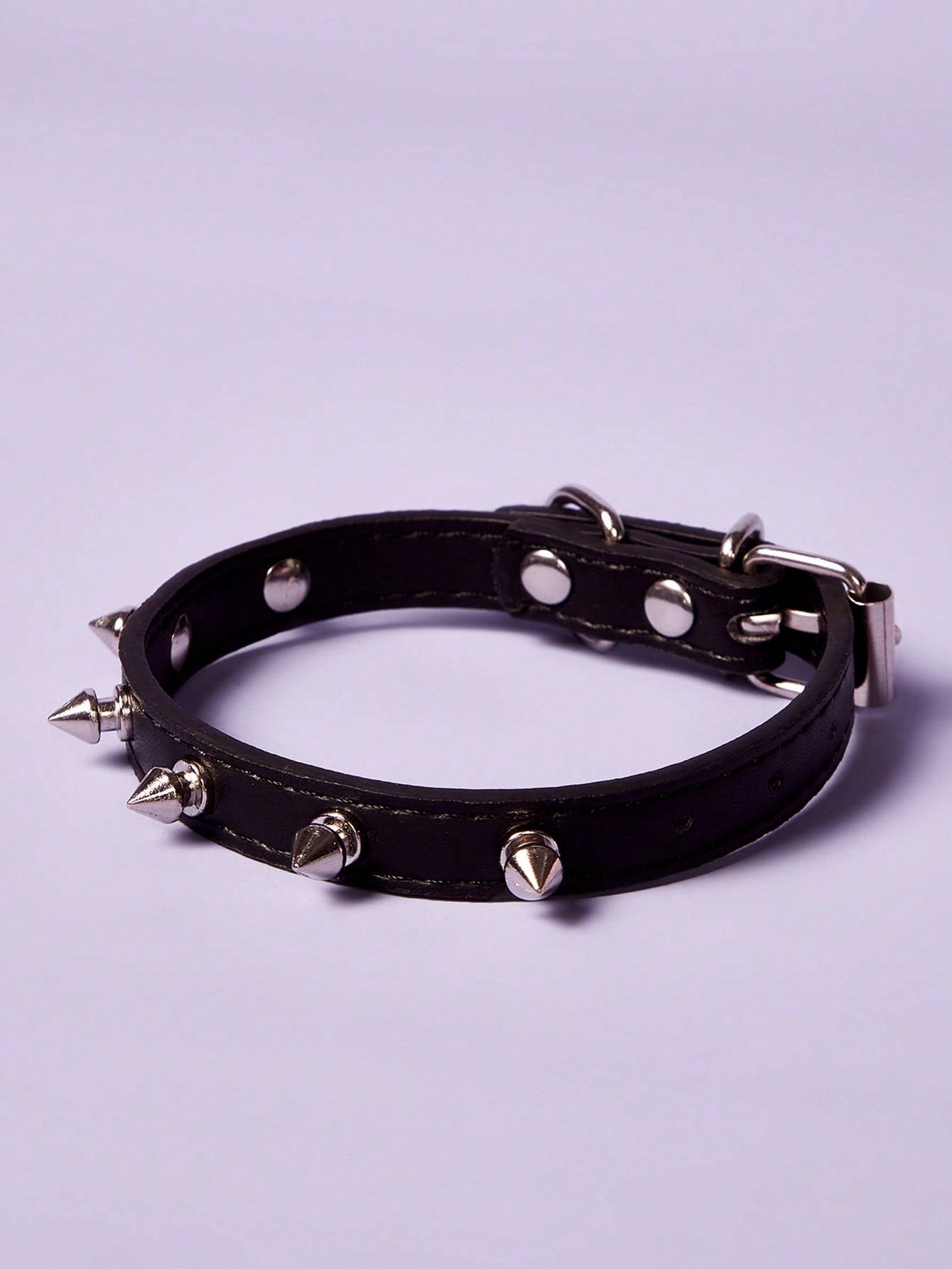 Black polyurethane pet collar with rivet decor and animal pattern styling for cats and dogs