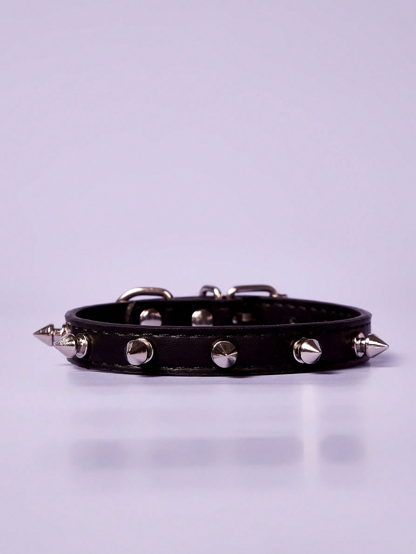 Black polyurethane pet collar with rivet decor and animal pattern styling for cats and dogs