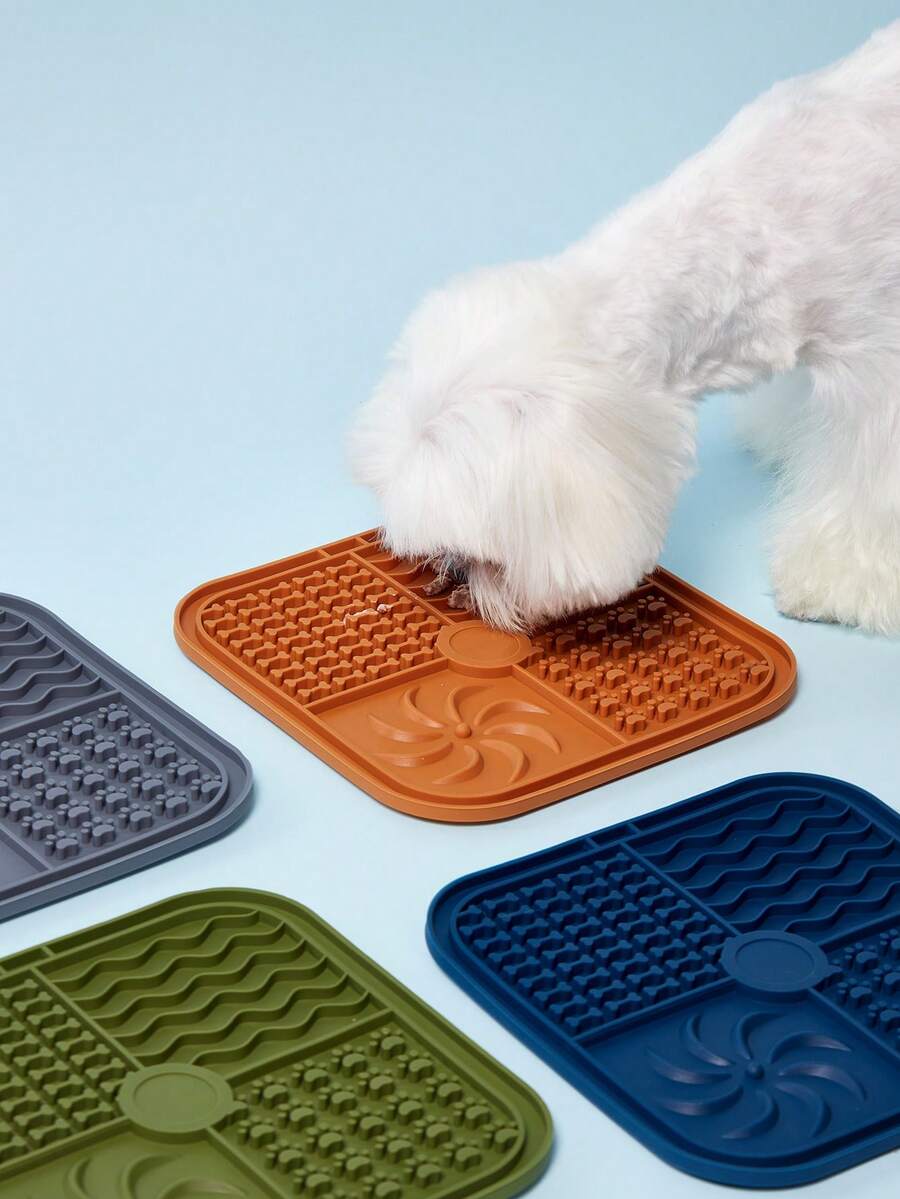 Multicolor square silicone dog lick mat featuring textured slow feeder patterns and suction cups.