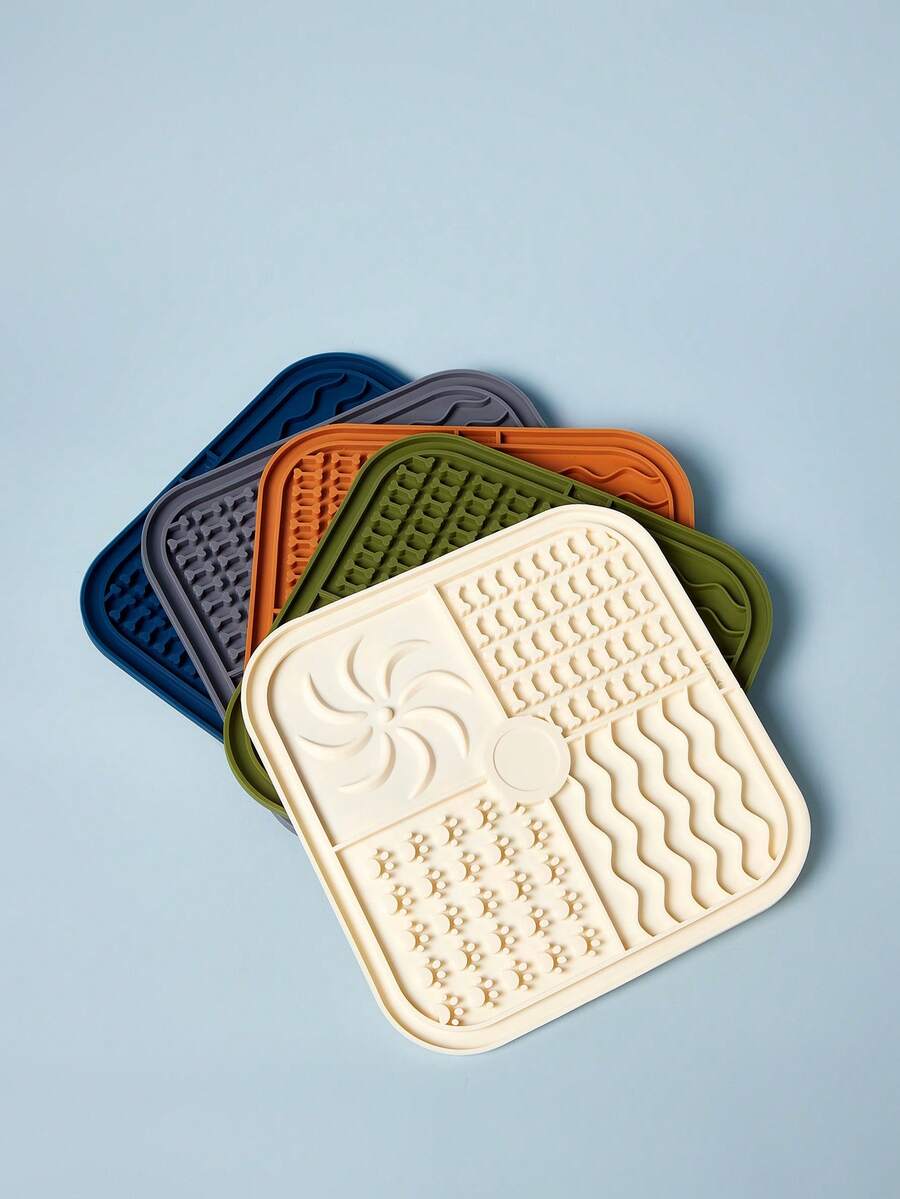 Multicolor square silicone dog lick mat featuring textured slow feeder patterns and suction cups.