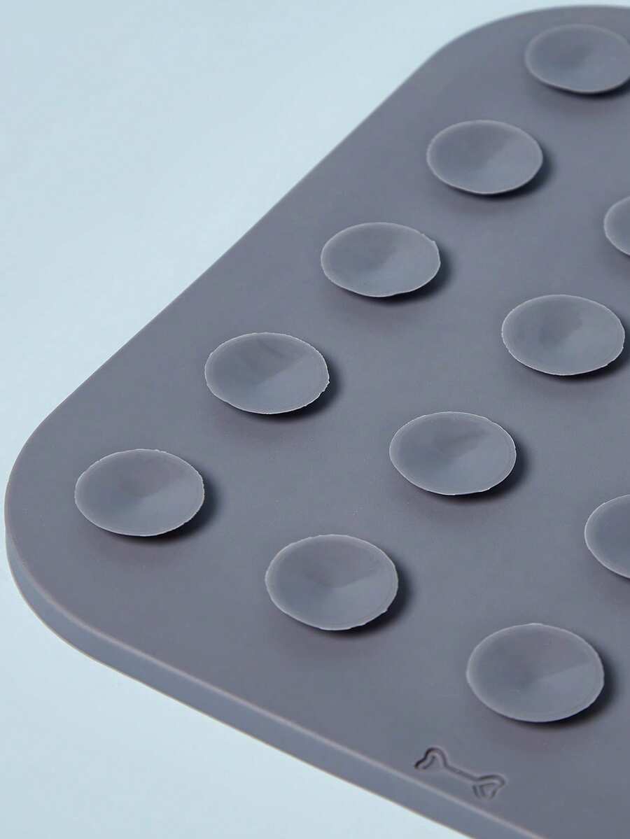 Multicolor square silicone dog lick mat featuring textured slow feeder patterns and suction cups.