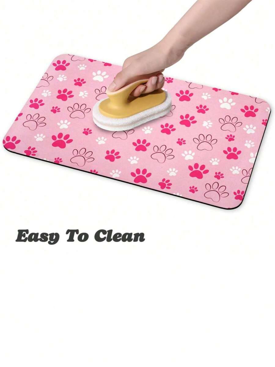 Black and white cartoon diatomite pet feeding mat placed under dog and cat food and water bowls to catch spills.