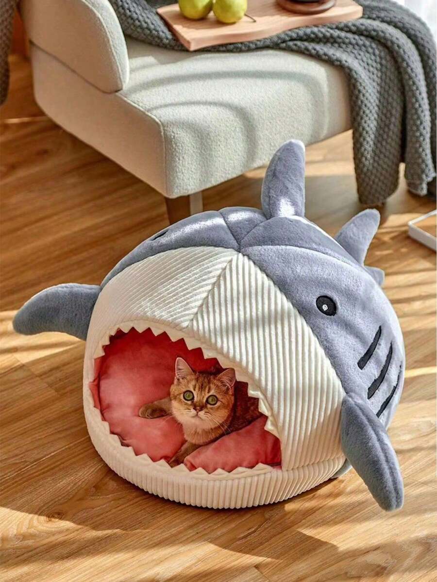 Blue shark-shaped enclosed pet bed nest made of soft polyester fabric for cats and small dogs.