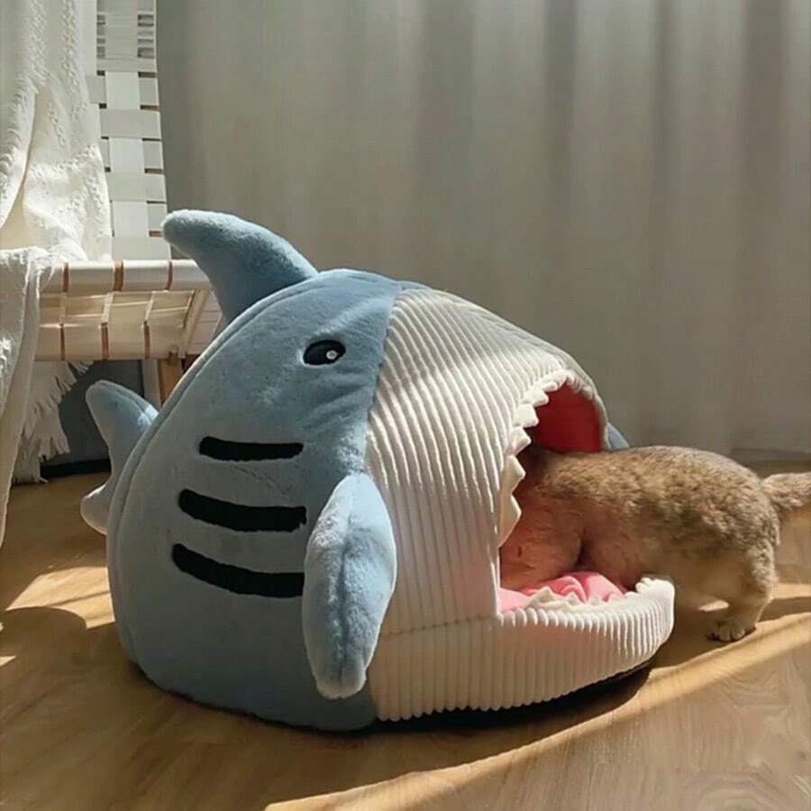 Blue shark-shaped enclosed pet bed nest made of soft polyester fabric for cats and small dogs.