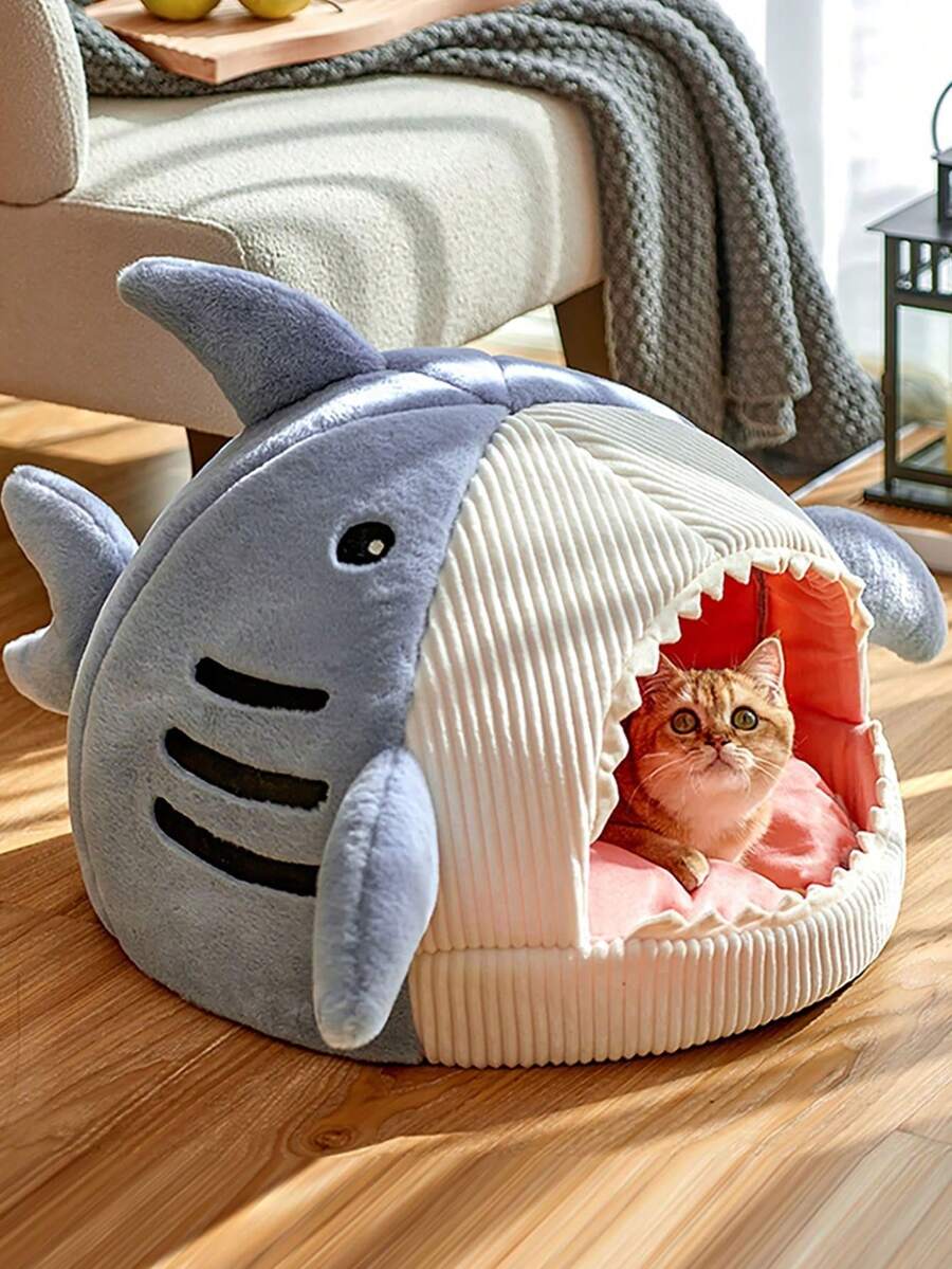 Blue shark-shaped enclosed pet bed nest made of soft polyester fabric for cats and small dogs.