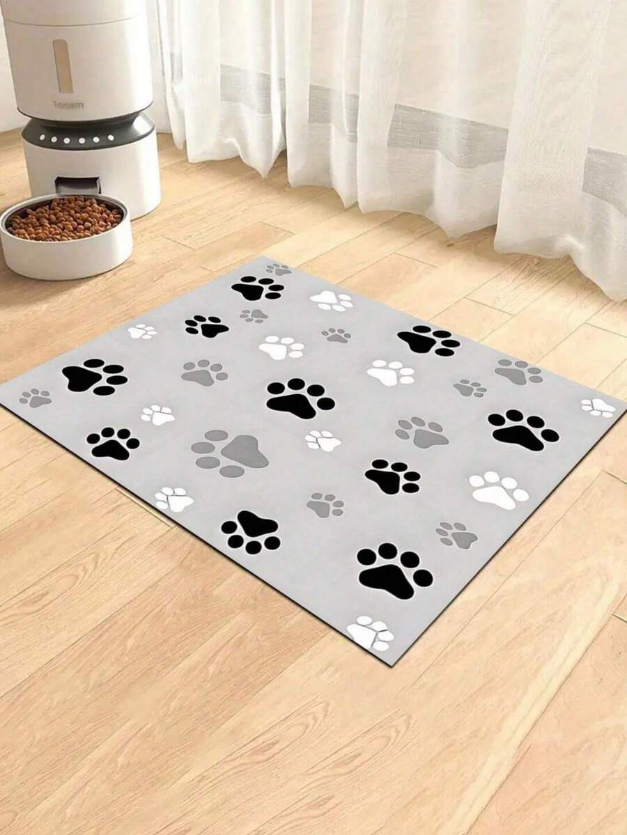 Black and white cartoon diatomite pet feeding mat placed under dog and cat food and water bowls to catch spills.