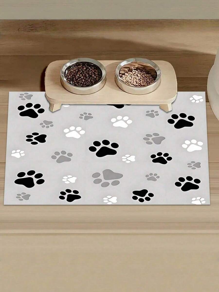 Black and white cartoon diatomite pet feeding mat placed under dog and cat food and water bowls to catch spills.