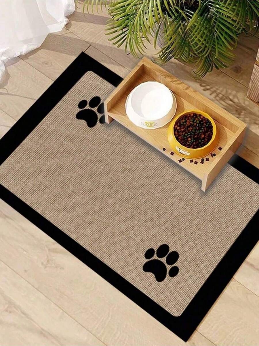 Black and white cartoon diatomite pet feeding mat placed under dog and cat food and water bowls to catch spills.