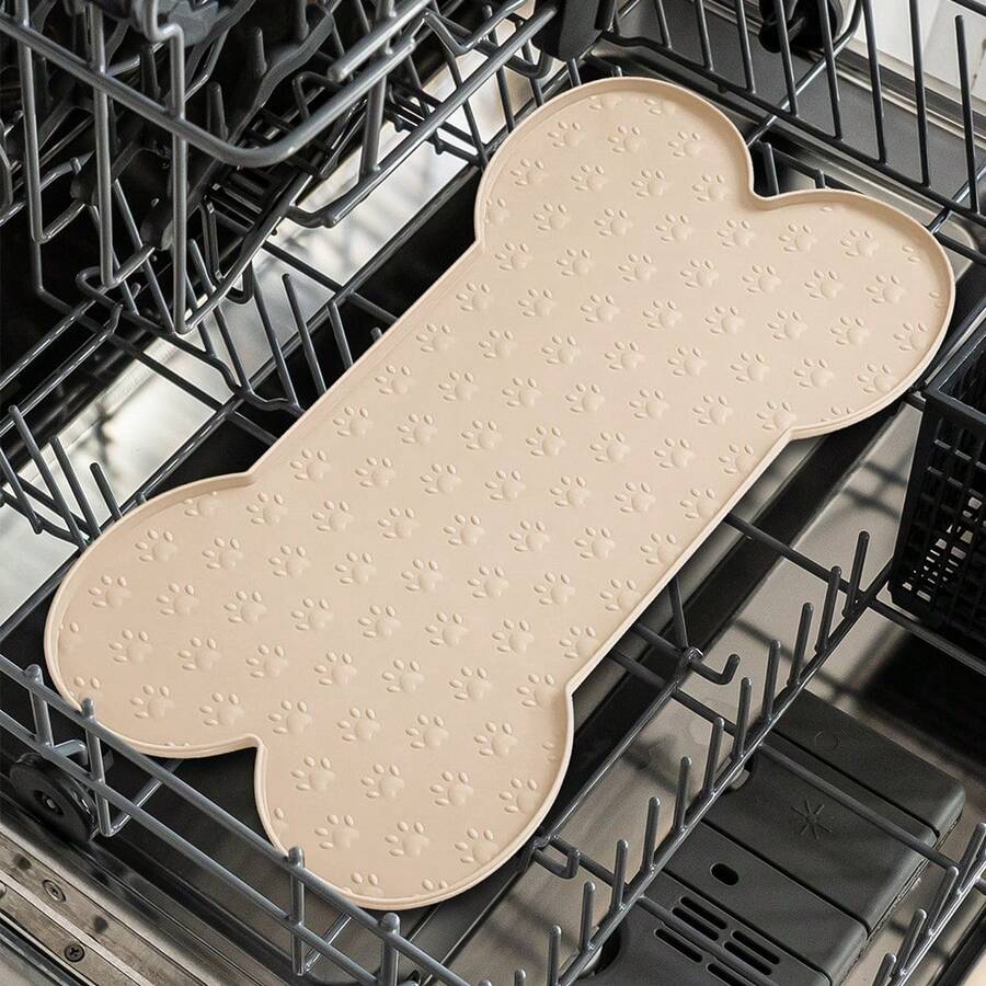 Multicolor bone-shaped silicone pet feeding mat with high spill-proof edge for cat and dog food and water bowls.