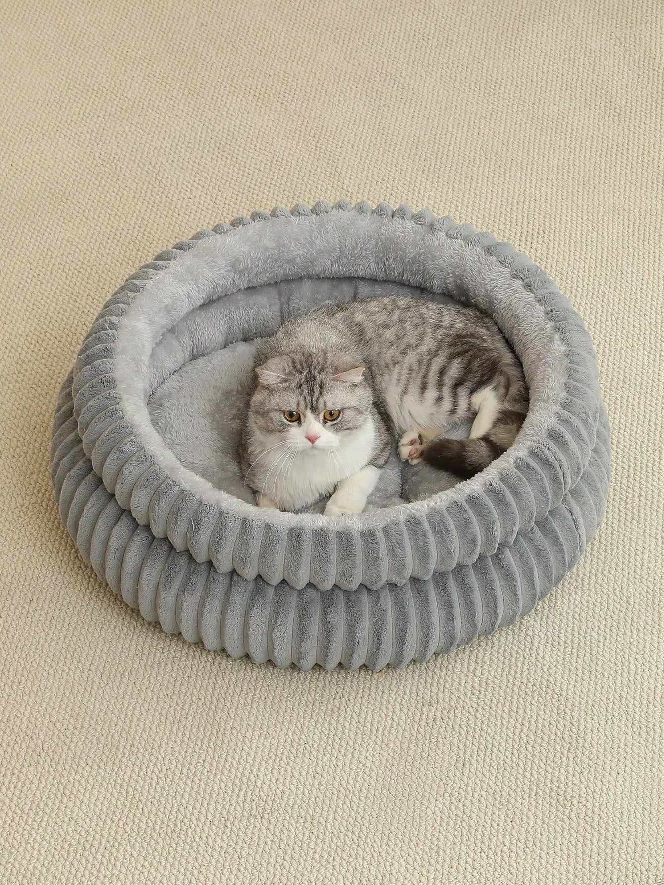 Grey soft fabric cat nest bed filled with comfortable polyester for small, medium, and large cats.