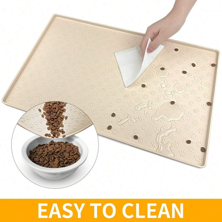 Beige silicone pet placemat with paw detail designed for cat and dog food and water bowls