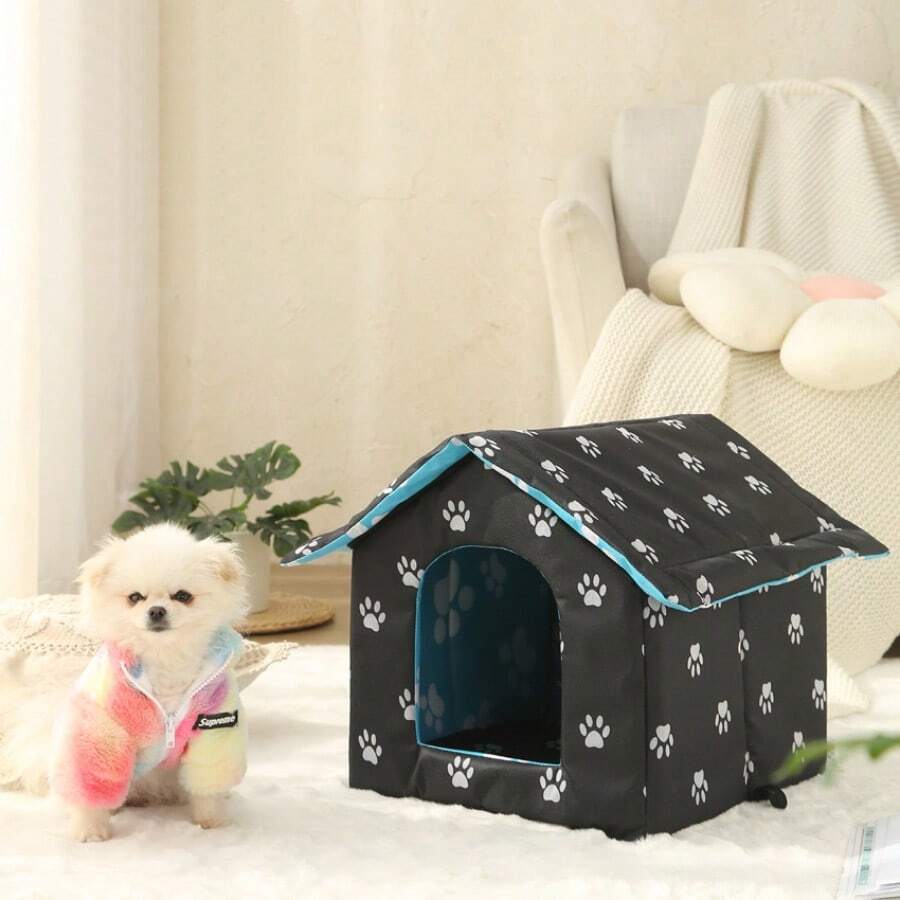 Black house-shaped outdoor waterproof cat bed made of 600D Oxford cloth with high-density foam insulation and a 4-season memory foam cushion.