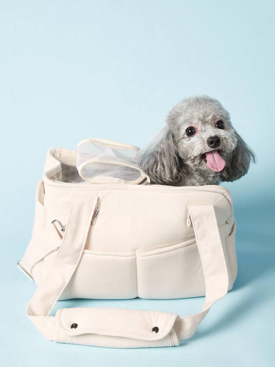 Multicolor breathable pet shoulder carry bag and portable crossbody dog and cat carrier made of 100% polyester.