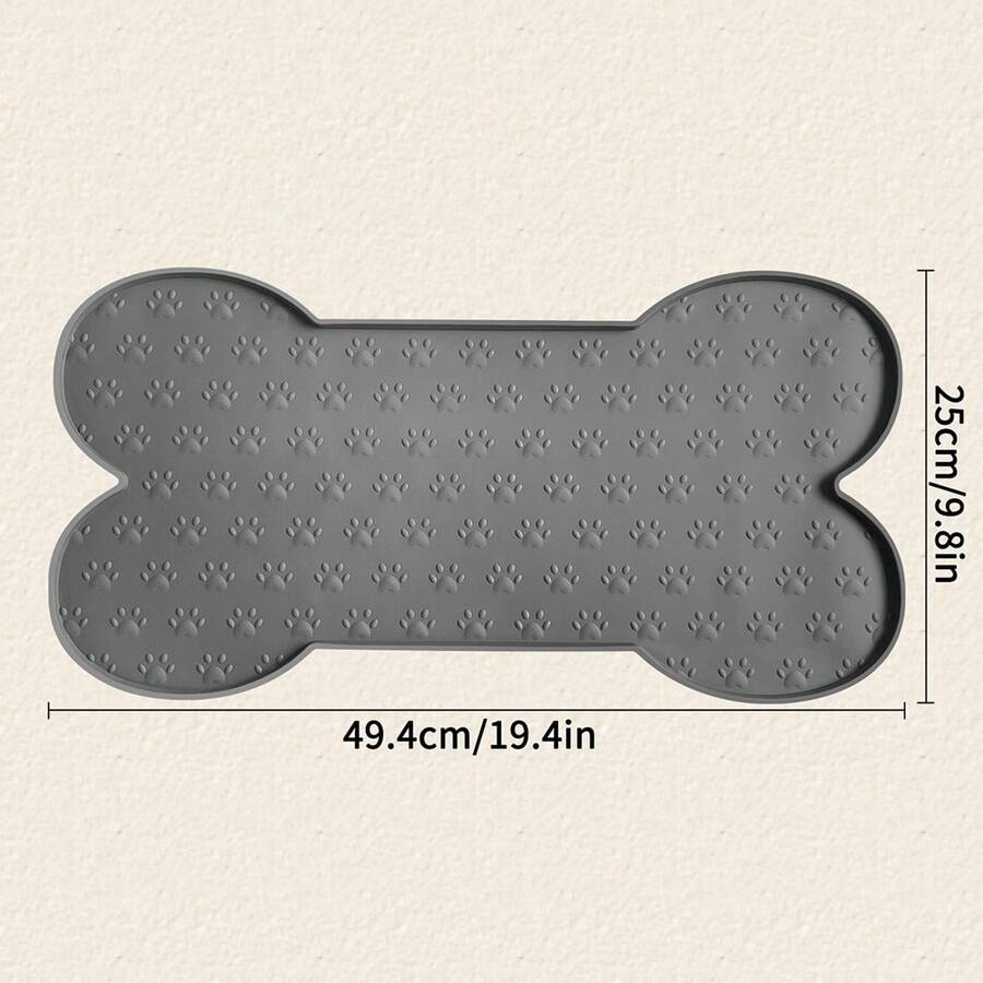 Multicolor bone-shaped silicone pet feeding mat with high spill-proof edge for cat and dog food and water bowls.