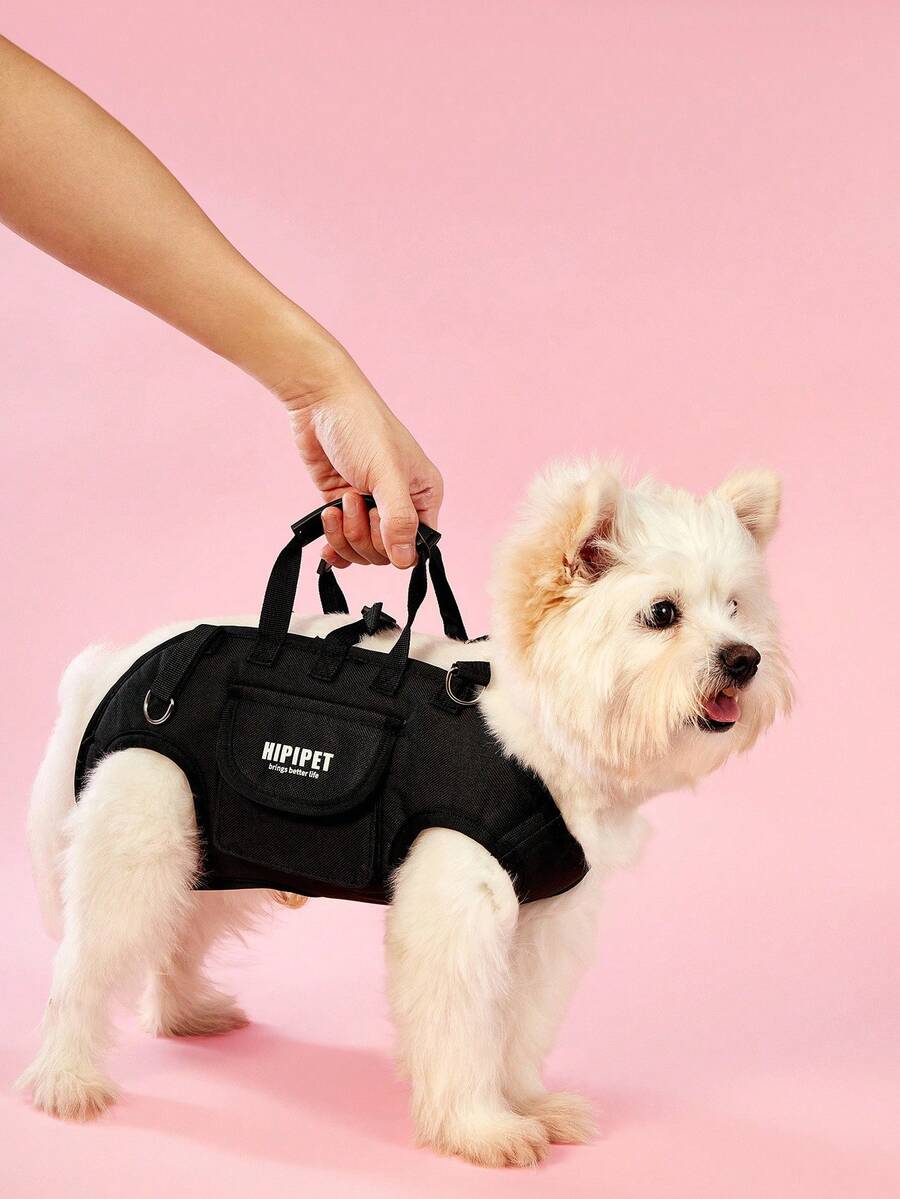Black breathable dog backpack with adjustable straps for carrying pets in crossbody or shoulder style