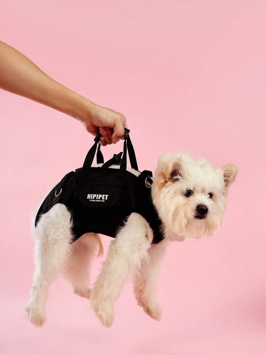 Black breathable dog backpack with adjustable straps for carrying pets in crossbody or shoulder style