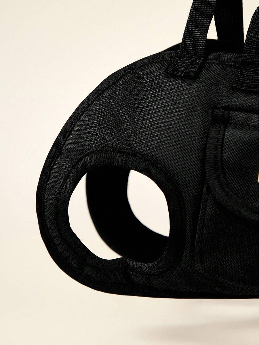 Black breathable dog backpack with adjustable straps for carrying pets in crossbody or shoulder style
