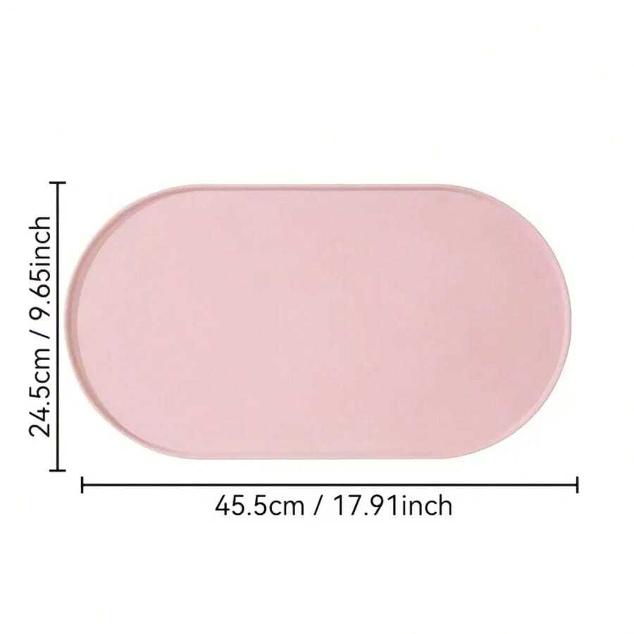 Beige oval silicone pet food mat with anti-slip and waterproof design for cat and dog bowls
