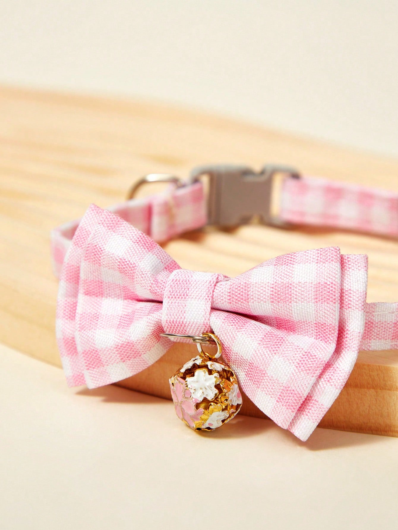 Pink plaid adjustable pet collar with pendant for cats and dogs, made from polyester with plated precious metal detailing.