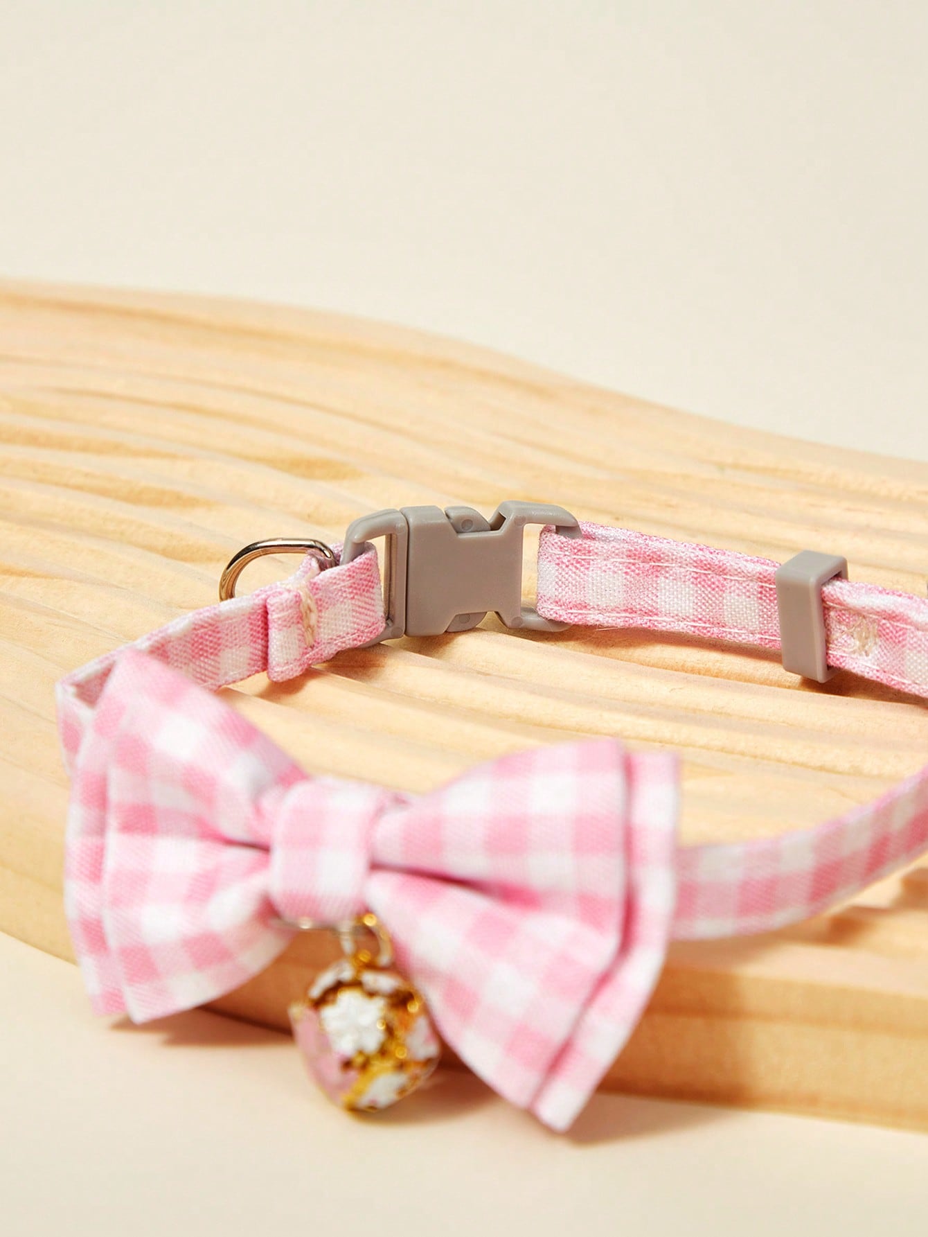 Pink plaid adjustable pet collar with pendant for cats and dogs, made from polyester with plated precious metal detailing.