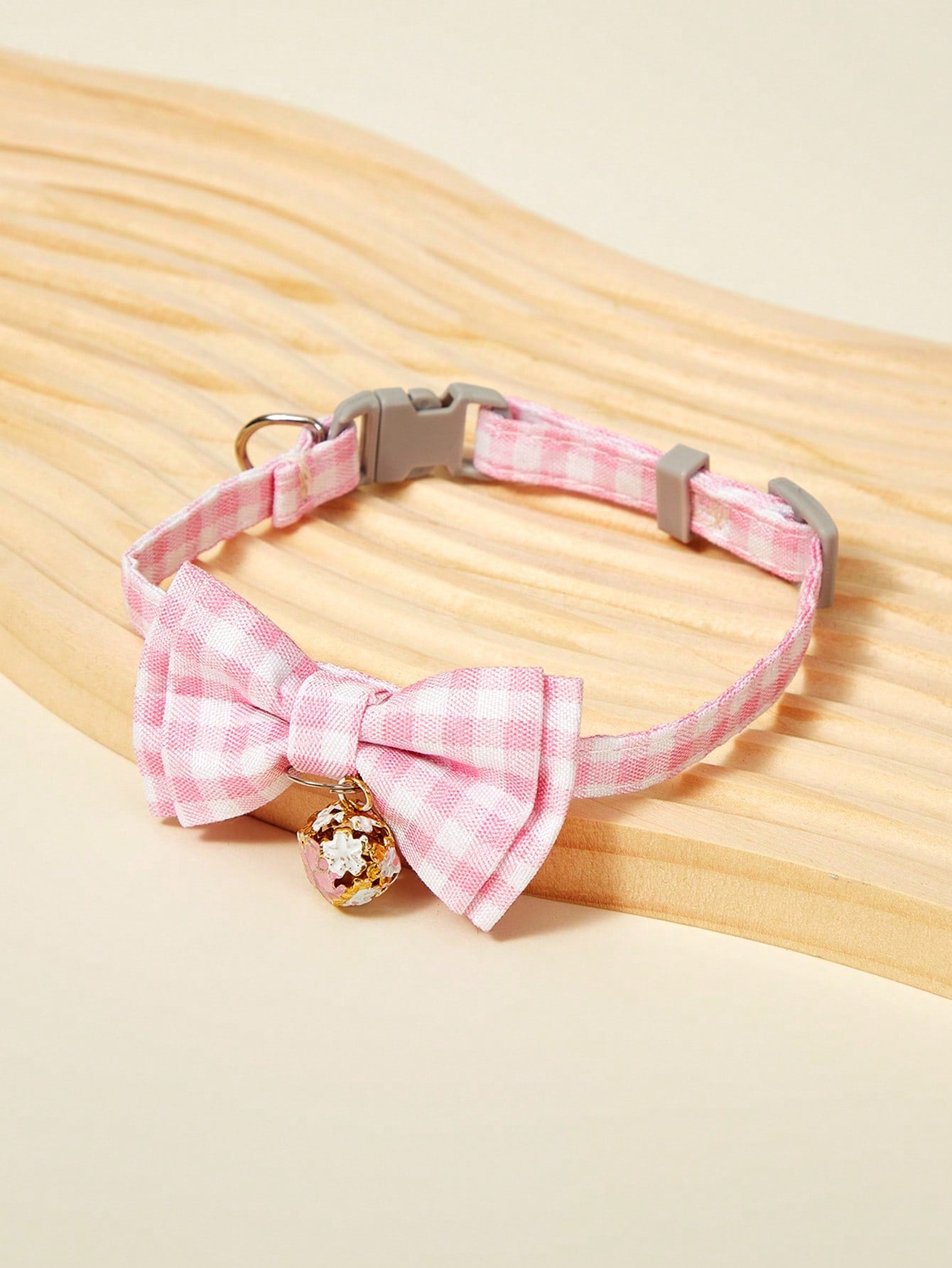 Pink plaid adjustable pet collar with pendant for cats and dogs, made from polyester with plated precious metal detailing.