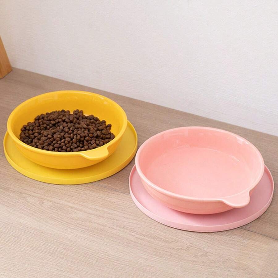 Round multicolor silicone pet food mat with raised edges for cats and dogs.