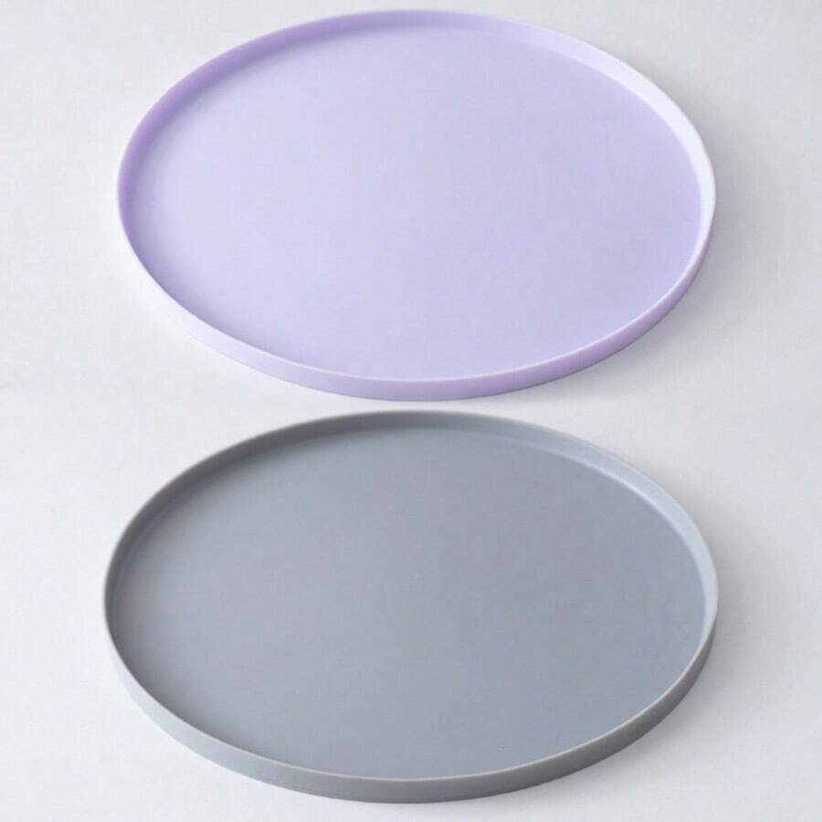 Round multicolor silicone pet food mat with raised edges for cats and dogs.