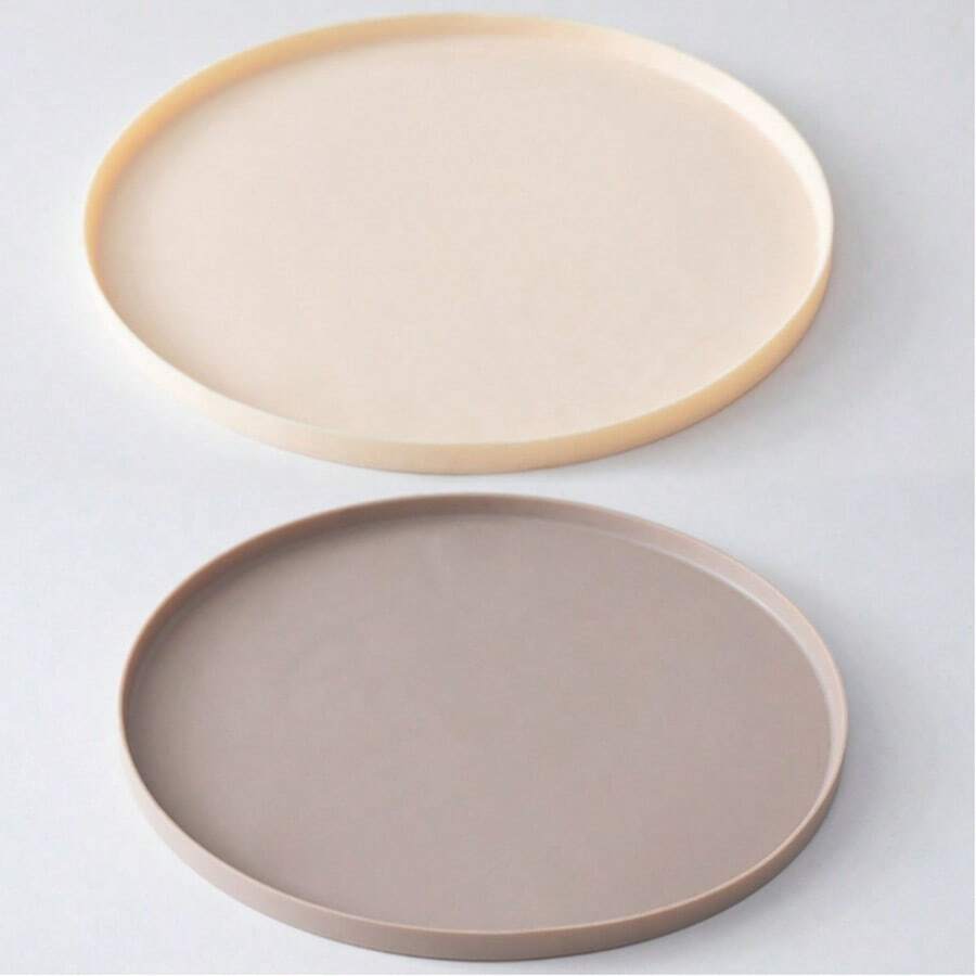Round multicolor silicone pet food mat with raised edges for cats and dogs.