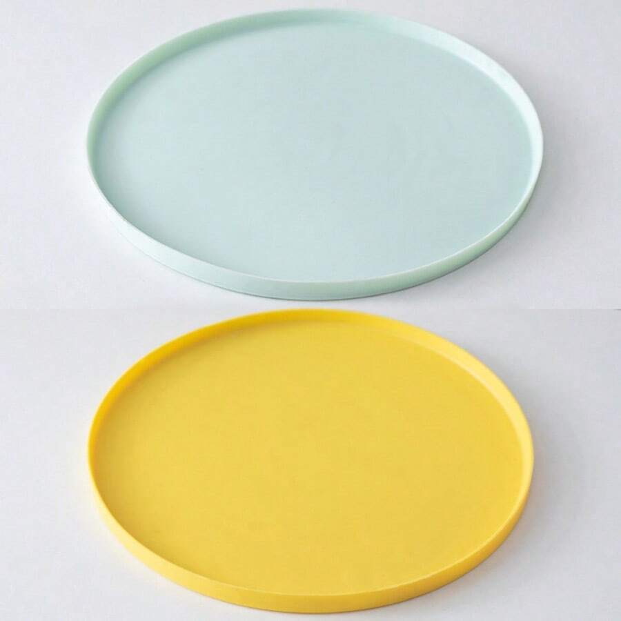 Round multicolor silicone pet food mat with raised edges for cats and dogs.
