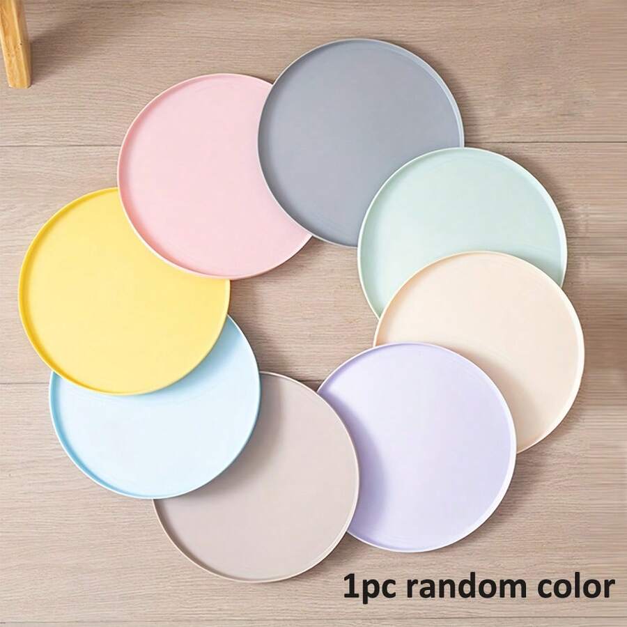 Round multicolor silicone pet food mat with raised edges for cats and dogs.