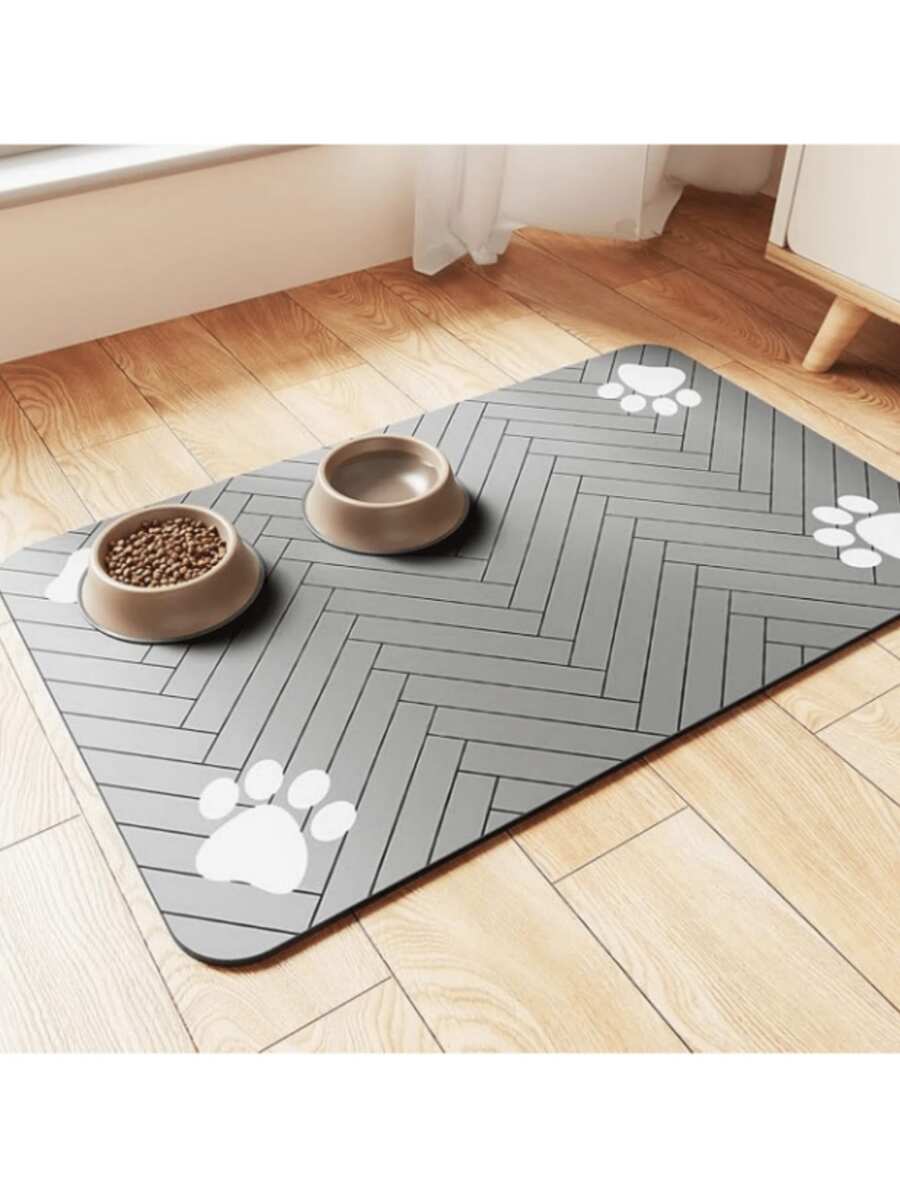 Quick-drying cartoon pet feeding mat for cats and dogs featuring an absorbent splash-proof polyester design.