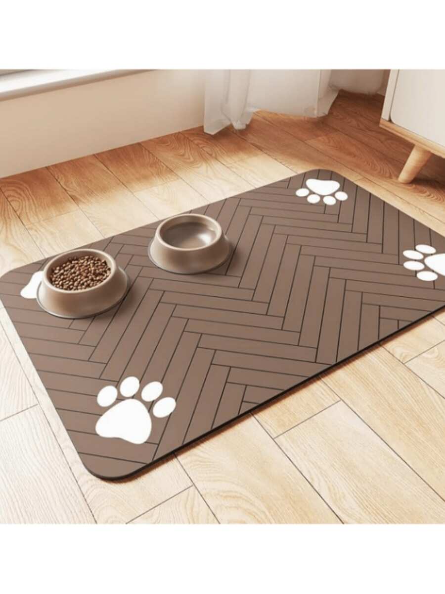 Quick-drying cartoon pet feeding mat for cats and dogs featuring an absorbent splash-proof polyester design.