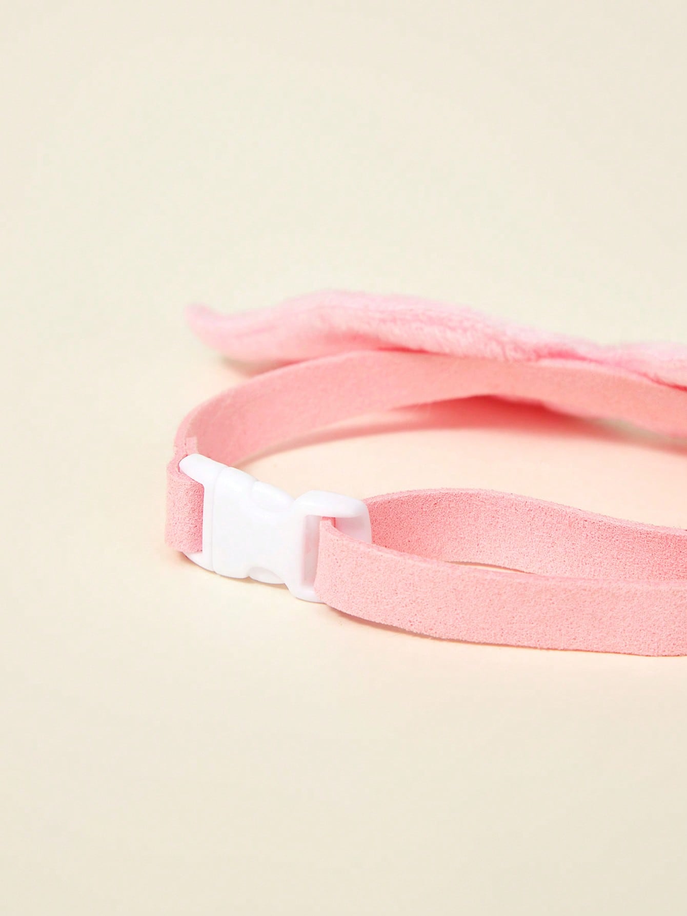 Pink pet angel wing collar accessory with white bow tie costume detail for cats and dogs, suitable for Halloween and Christmas pet apparel