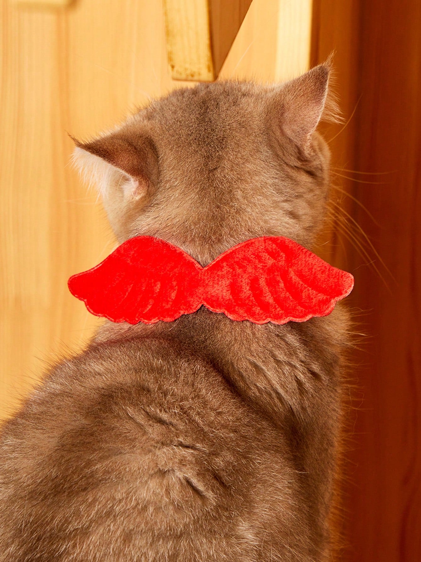 Pink pet angel wing collar accessory with white bow tie costume detail for cats and dogs, suitable for Halloween and Christmas pet apparel