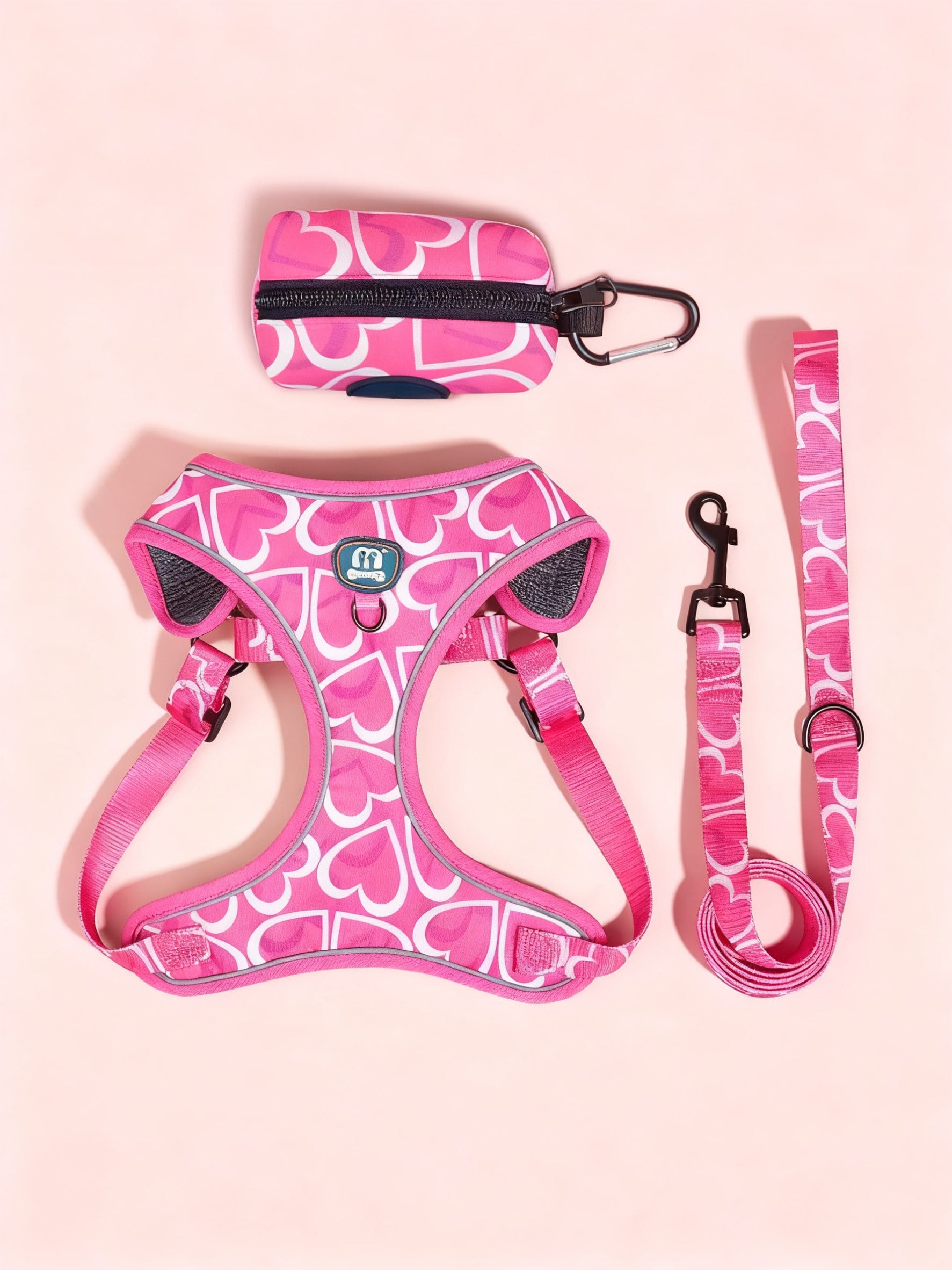 Hot pink heart print adjustable dog harness and leash set with matching poop bag holder for outdoor walking