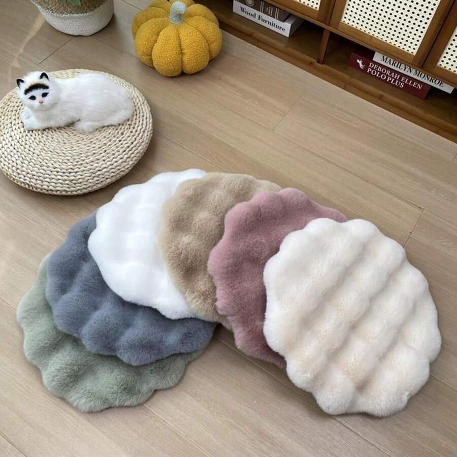 Multicolor round pet sleeping pad made of soft 100% polyester fabric suitable for cats and small pets.