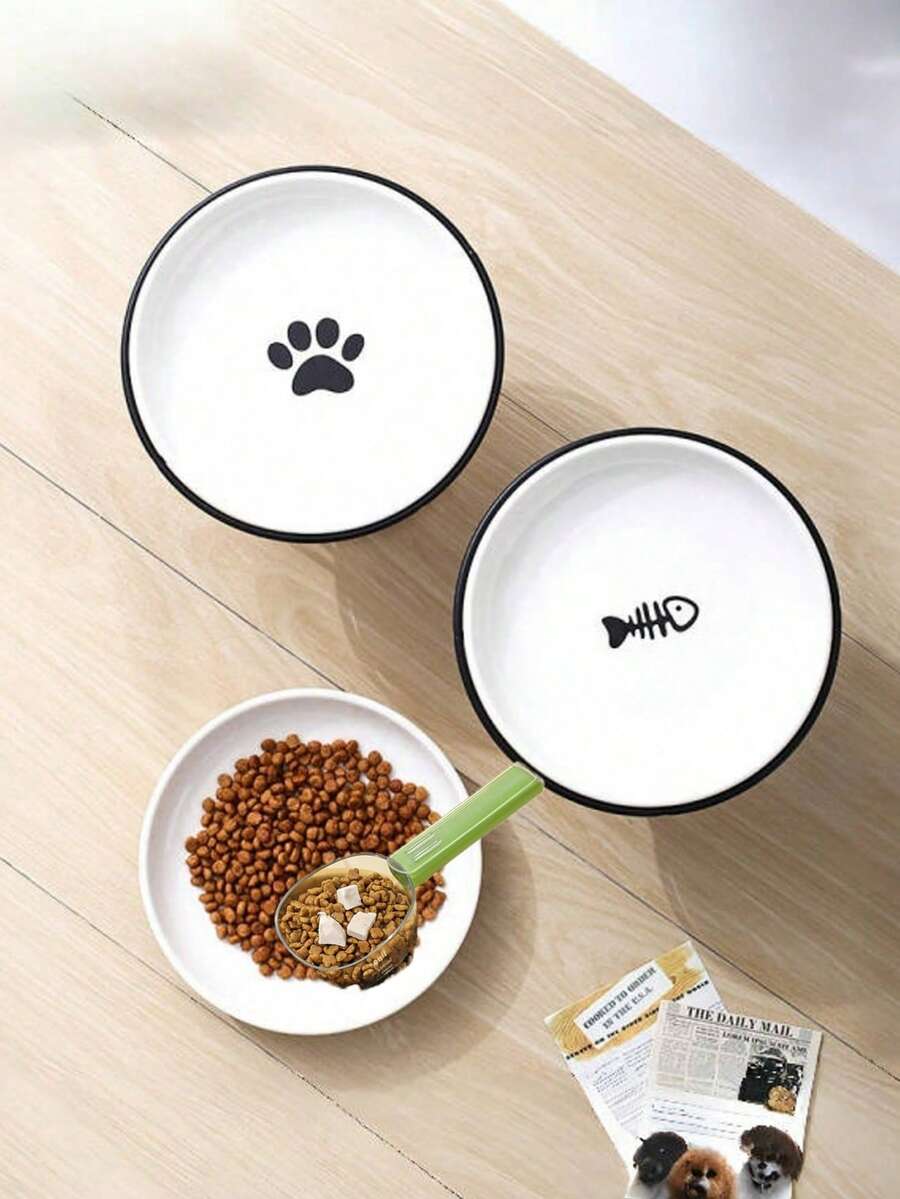 White elevated ceramic pet bowl set with non-slip stand featuring cat paw and fishbone designs