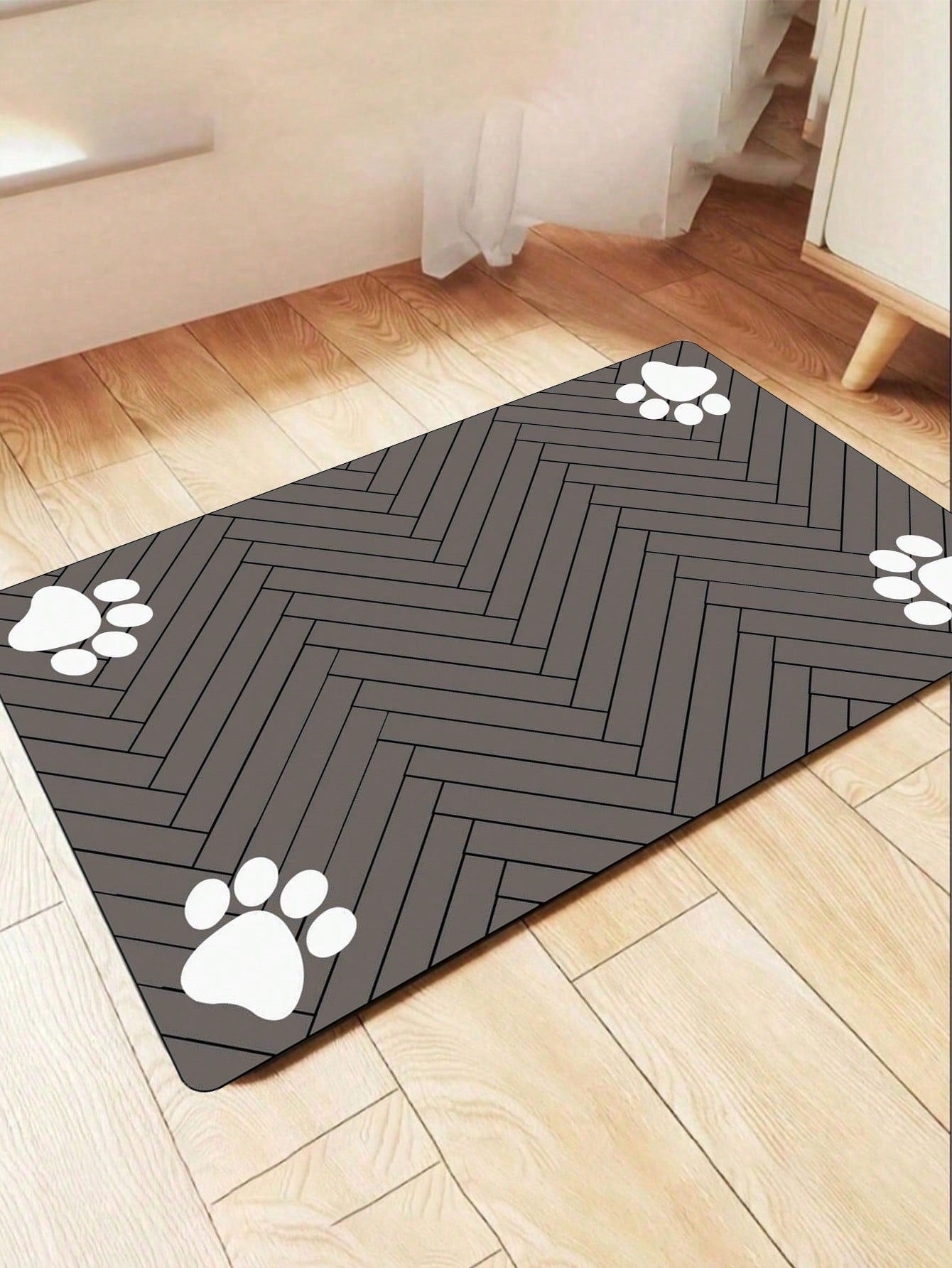 Black and white cartoon diatomite pet feeding mat placed under dog and cat food and water bowls to catch spills.