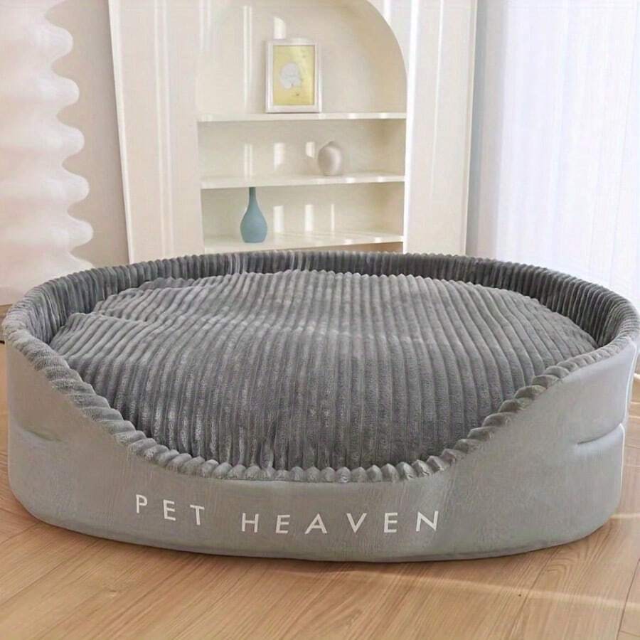 Grey washable round dog bed with dual-sided high and low side design filled with cotton for cats and dogs.
