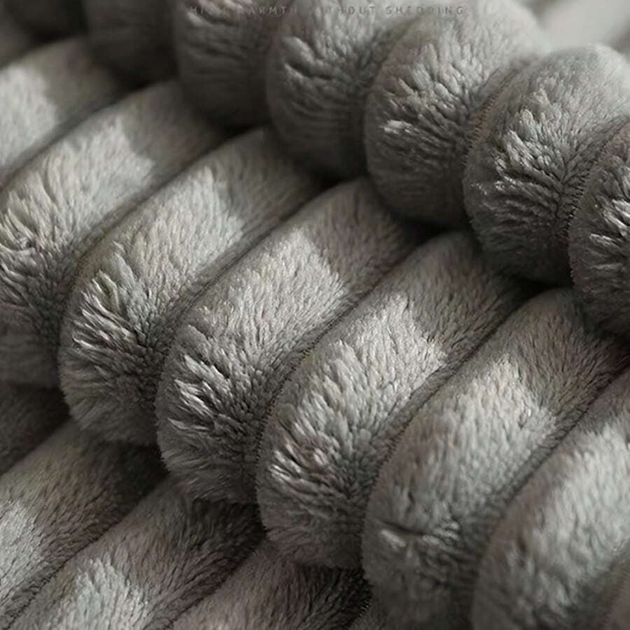 Grey washable round dog bed with dual-sided high and low side design filled with cotton for cats and dogs.