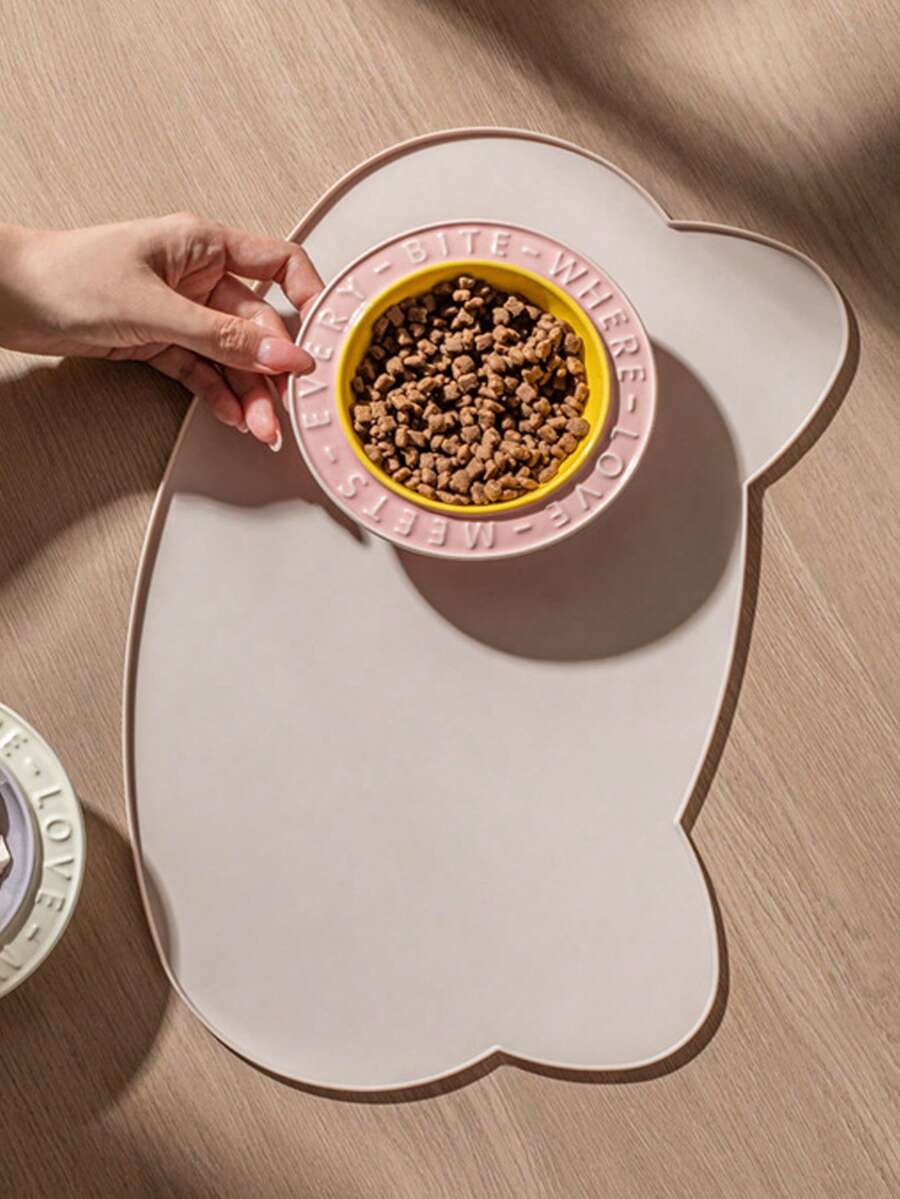 Multicolor silicone pet food mat with cartoon pattern, waterproof non-slip surface, and raised edges for dog and cat bowls.