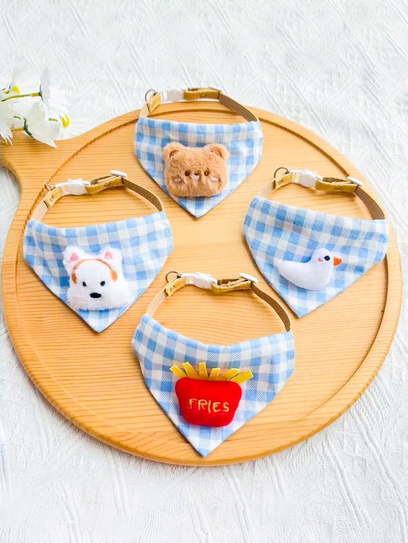 Multicolor polyester triangular pet bandana collar with cartoon design for cats and dogs, used as a cute drooling towel and pet accessory.