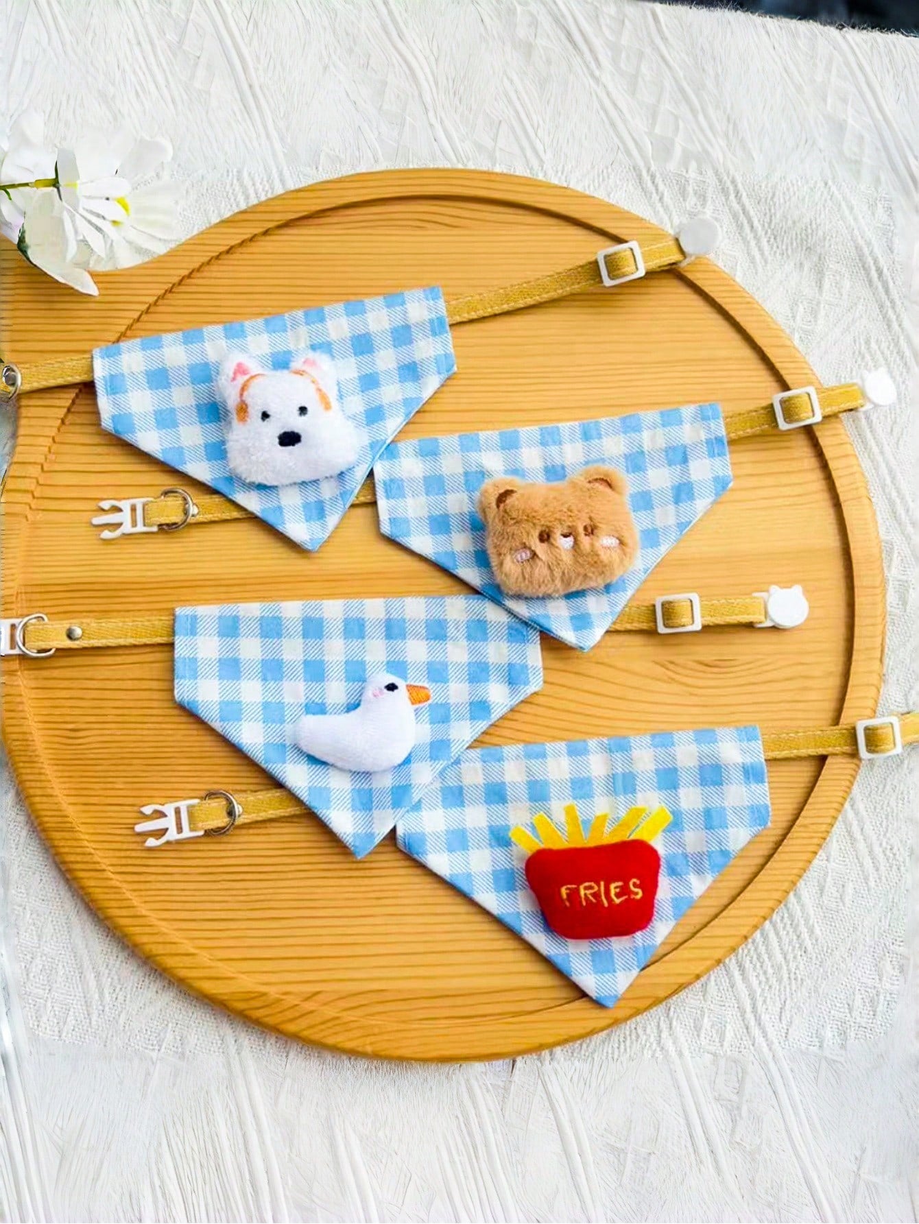 Multicolor polyester triangular pet bandana collar with cartoon design for cats and dogs, used as a cute drooling towel and pet accessory.