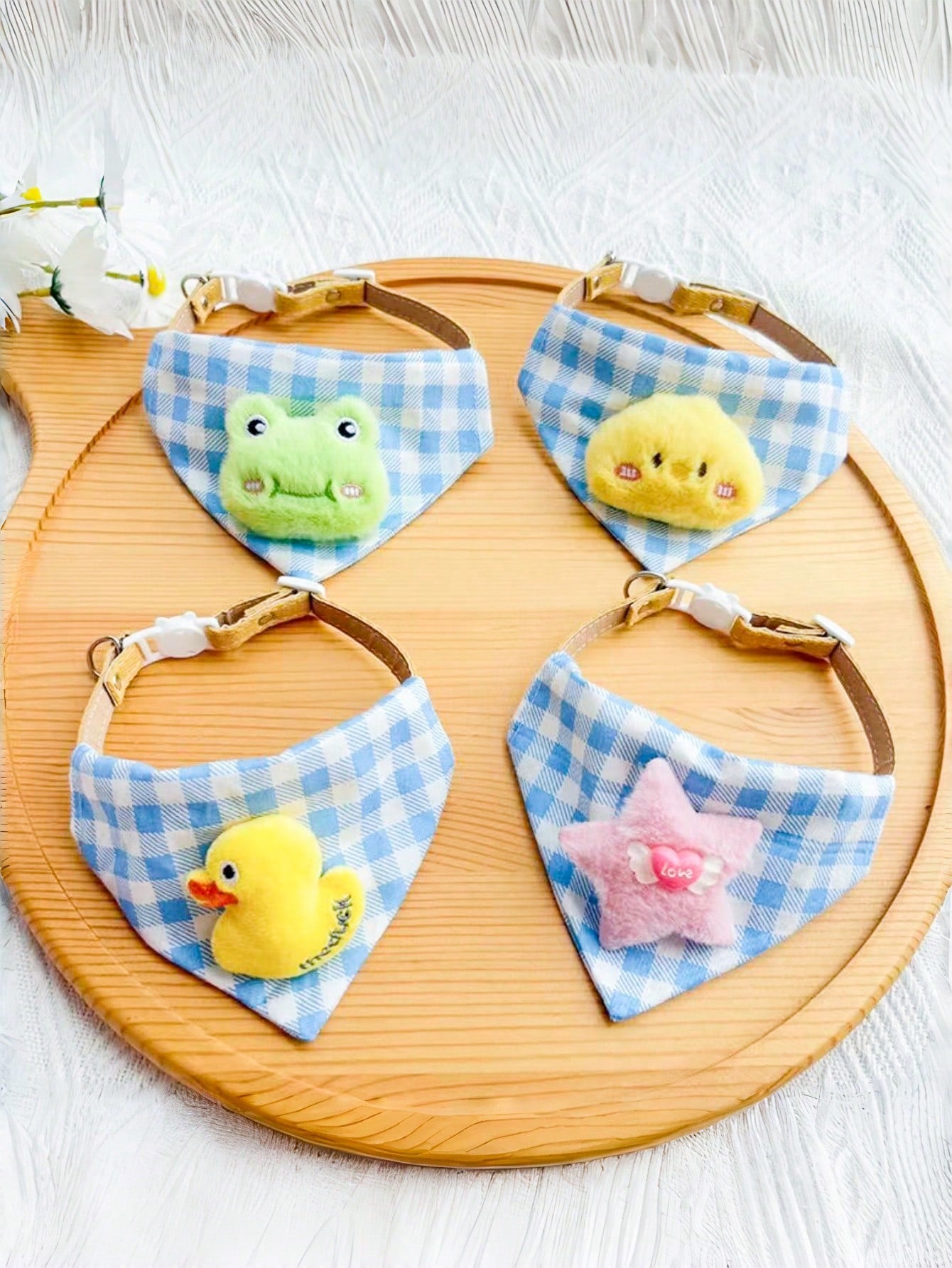 Multicolor polyester triangular pet bandana collar with cartoon design for cats and dogs, used as a cute drooling towel and pet accessory.