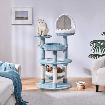 Butterslay 45.5 inch multi-level ocean themed cat tree tower in blue and white featuring plush perches, sisal scratching posts, a shark mouth nest, and a hammock for indoor cats.
