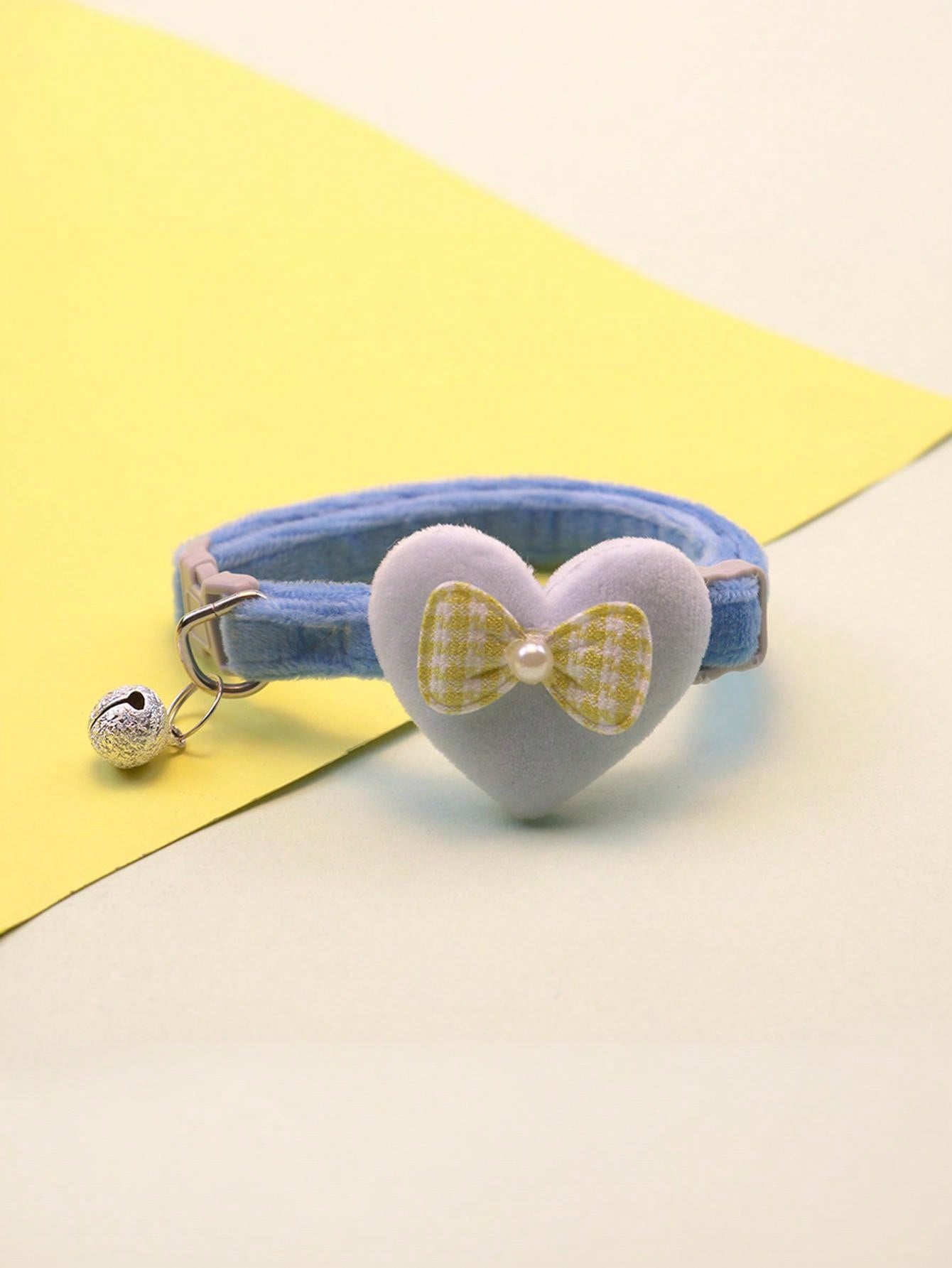 Multicolor adjustable polyester pet collar with cartoon heart-shaped bow decoration and bell pendant for small and medium cats and dogs.