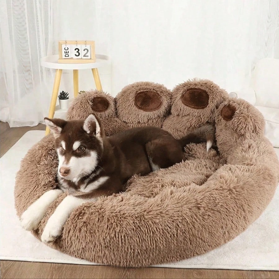 Brown plush donut pet bed with a curved headrest for cats and dogs made of soft polyester material.