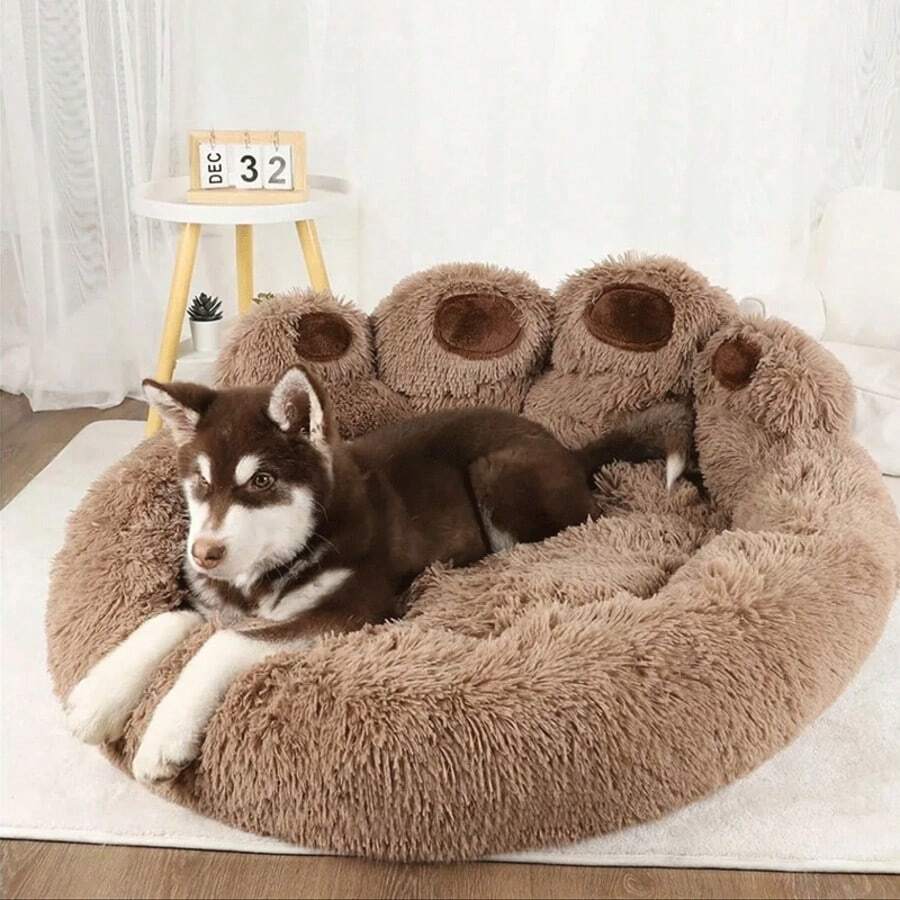 Brown plush donut pet bed with a curved headrest for cats and dogs made of soft polyester material.
